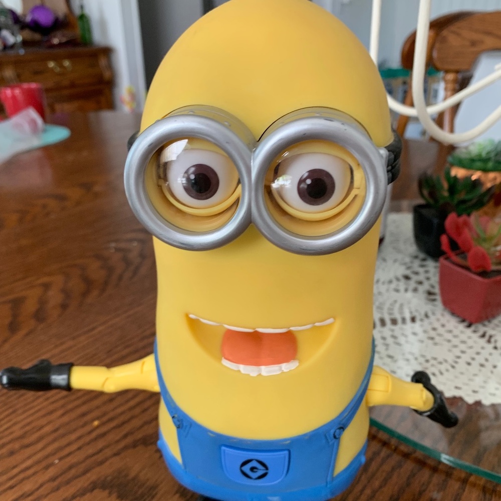 Universal Studios presents Kevin the minion push a button and it talks
